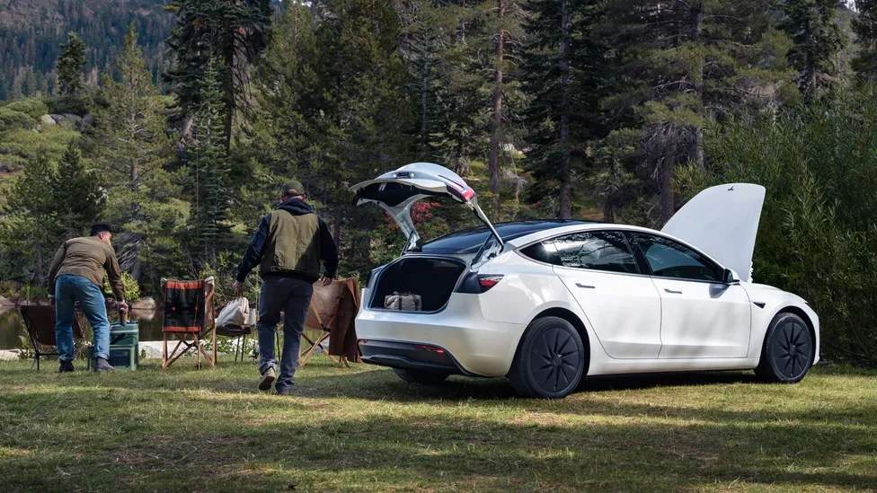 Tesla Model 3 Standard charging – rear three-quarter view highlighting compact sedan design